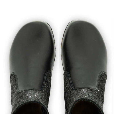 [Nero-Argento] Olga Damen Clog Stiefelette schwarz glitter woody. Damenstiefelette olga, clog stiefelette damen mit biegsamer nachhaltiger holzsohle, farbe: nero-argento (schwarz - schwarz mit silbernem glitter), holzclogs woody, woody schuhe, woody shoes, handgemachte holzschuhe aus österreich, kärnten