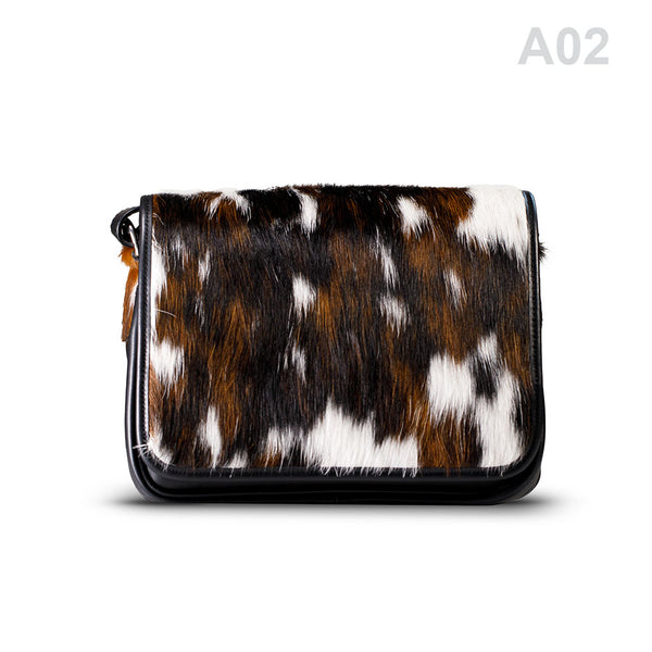 woody Klara Damen-Handtasche aus Natur-Fell in Schwarz-Braun, Variante A02