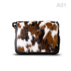 woody Klara Damen-Handtasche aus Natur-Fell in Schwarz mit Lederhenkel
